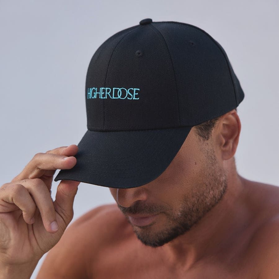 The HigherDOSE Red Light Hat held open, showing the LED panel.